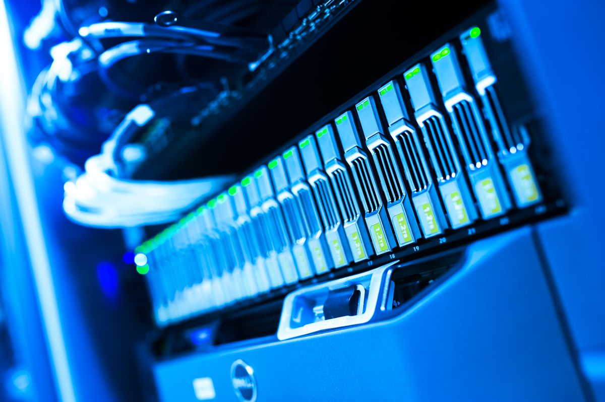Source photo of a blue-lit computer server rack in a data center