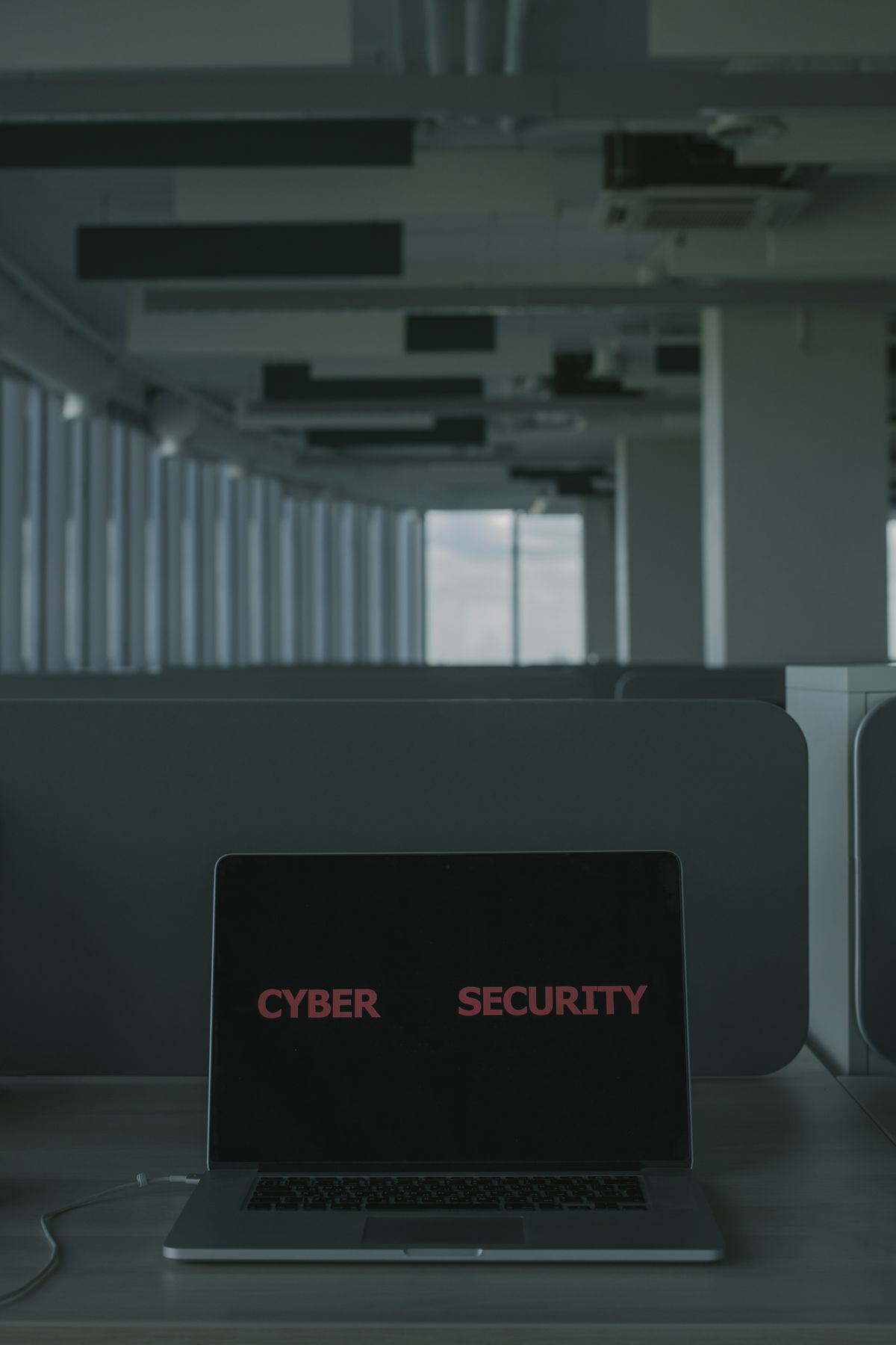 Source photo of a laptop displaying a cybersecurity concept